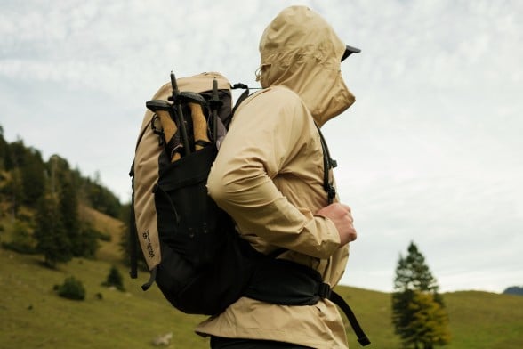 Photo of three hiking packs on rocky ground