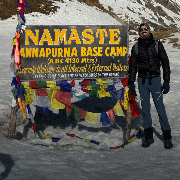 Ben in front of the base camp in the mountains