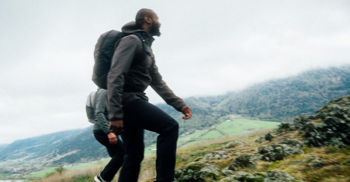 Couple in autumn outdoor clothing in a mountainous area