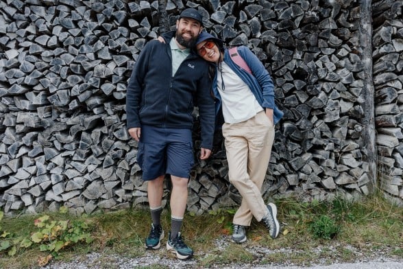 Close-up of a person in hiking boots scrambling over a&nbsp;rock